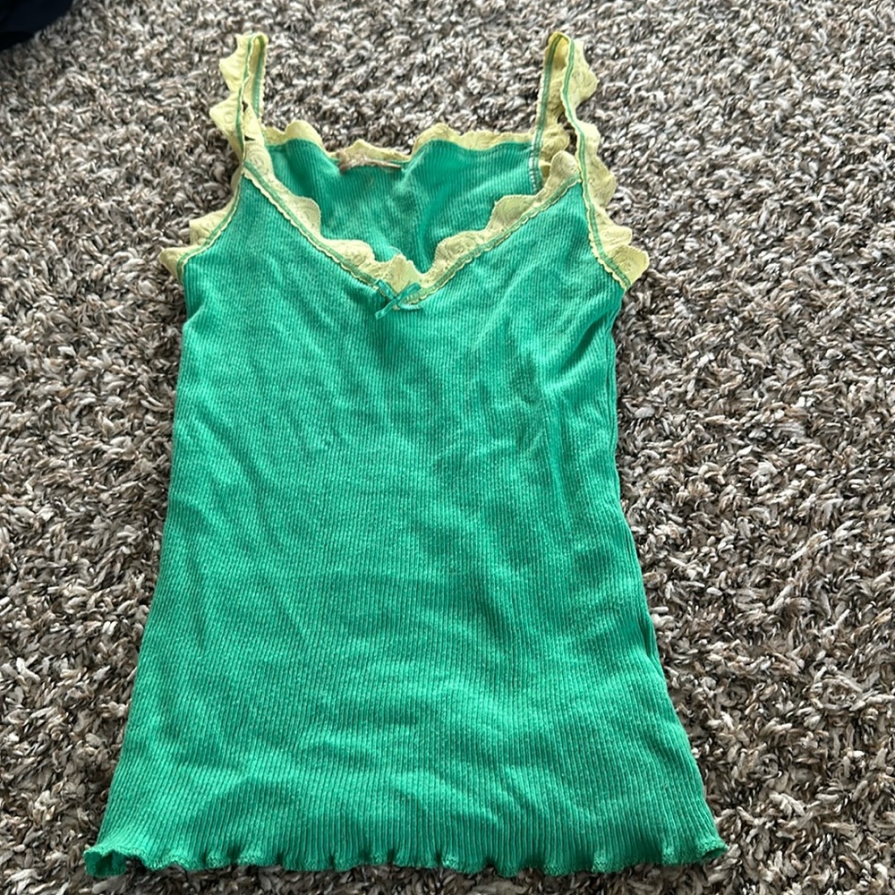 Cute green top with yellow lace straps.